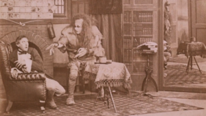 Scene from the 1910 Frankenstein with the monster menacing his creator
