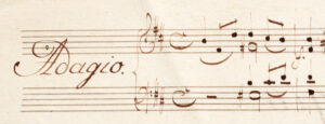 Small piece of a Mozart manuscript with the ornately written indication "Adagio"